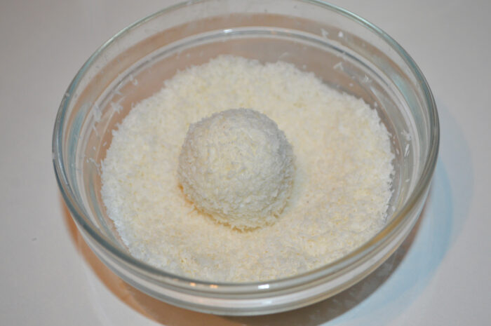 Then roll each ball in coconut flakes