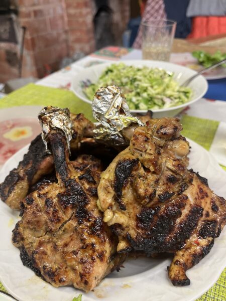 Succulent grilled chicken thighs served with greens