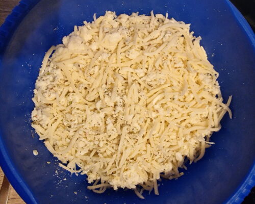 Grate the cheeses