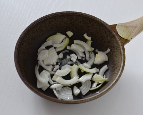 Place the chopped onion in a hot pan