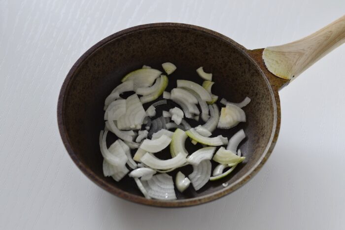 Place the chopped onion in a hot pan