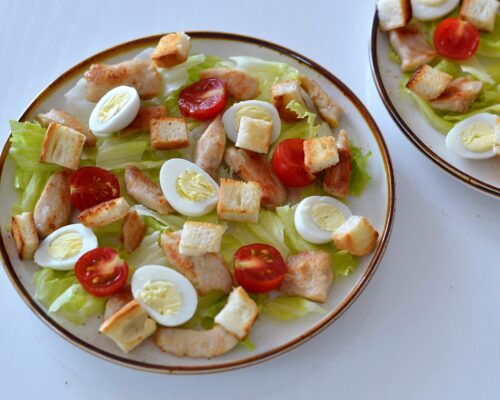 Cut the bread slices into small cubes and dry them