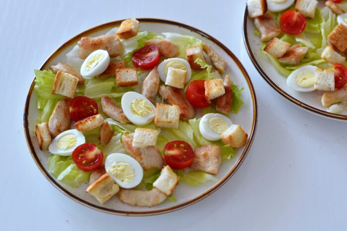 Cut the bread slices into small cubes and dry them