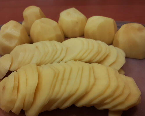 Peel potatoes, and cut