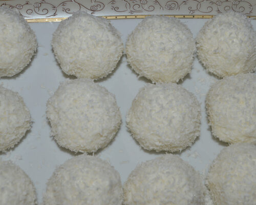 Homemade coconut-coated cheese treats ready to serve