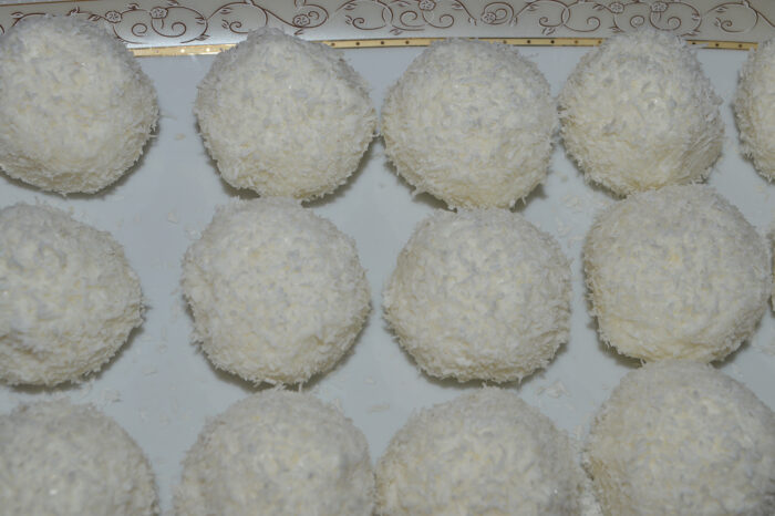 Homemade coconut-coated cheese treats ready to serve