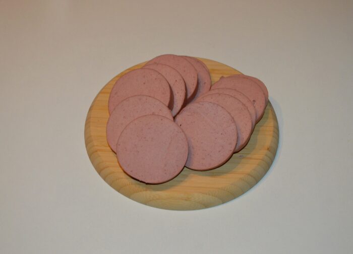 First, slice the salami