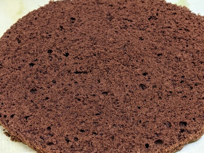 Let the cake cool and cut it in half