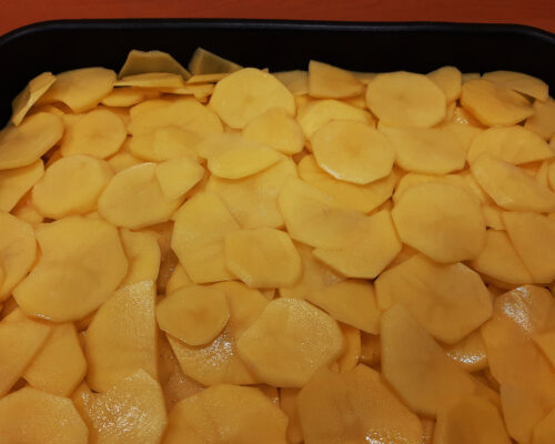 Then spread a layer of potatoes