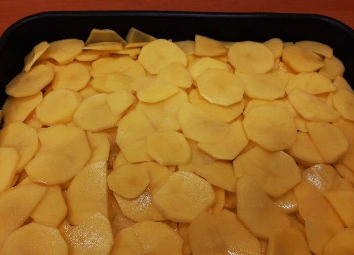 Then spread a layer of potatoes