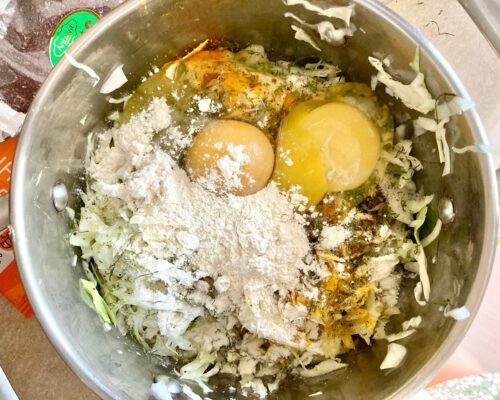 Add the eggs and 1 tablespoon of flour