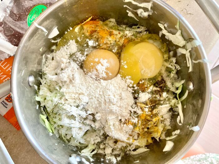 Add the eggs and 1 tablespoon of flour