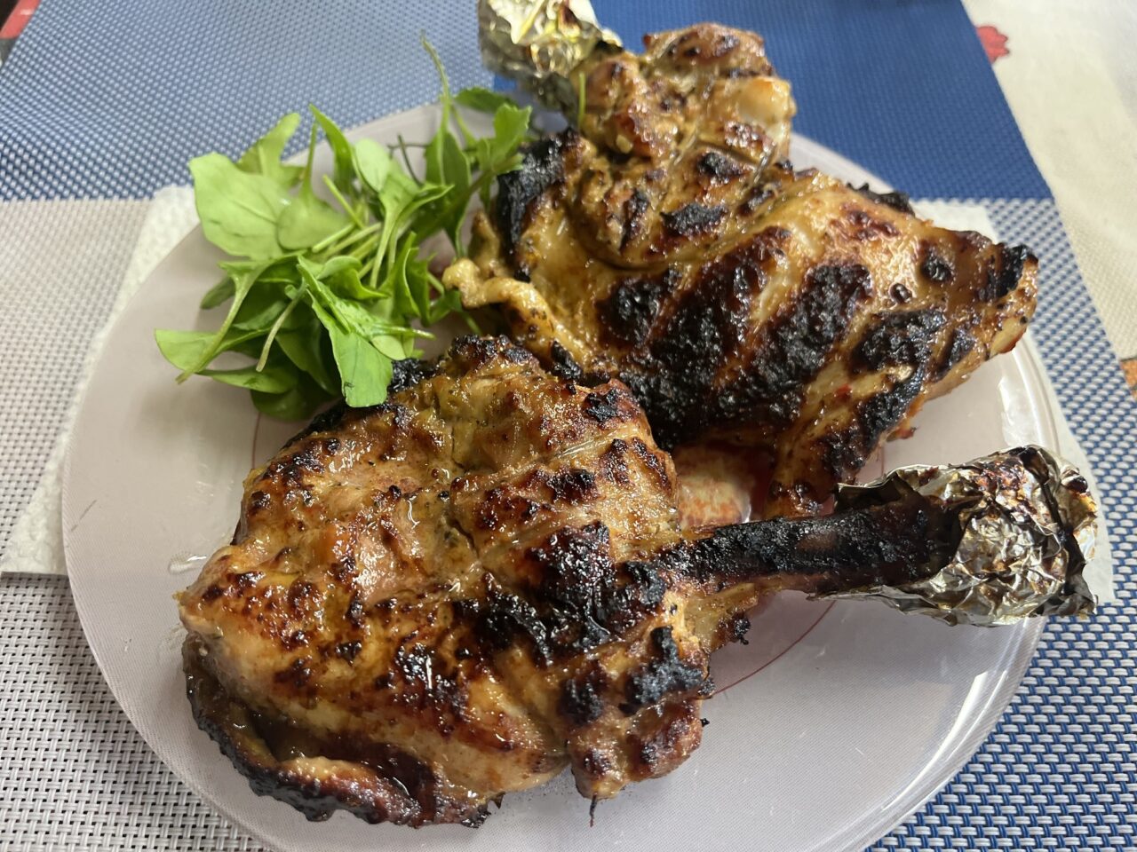 Grilled chicken thighs marinated in garlic, honey, mustard and spices
