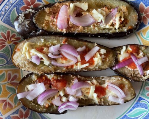 Sprinkle with onion and garlic cloves