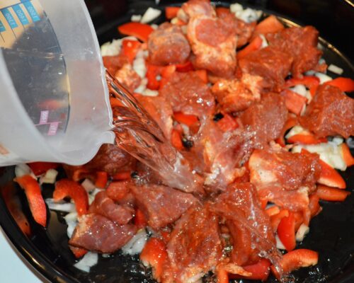 Pour in enough water to cover the meat and vegetables