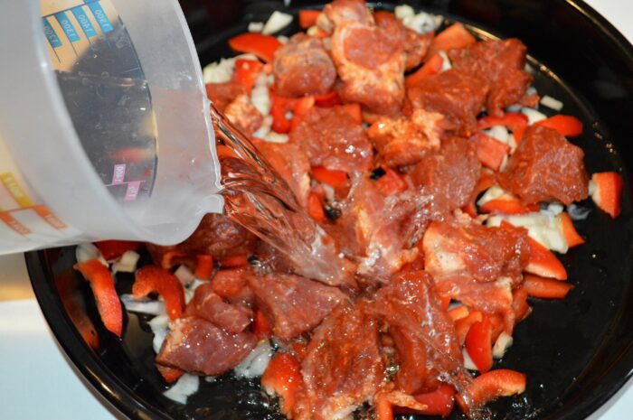 Pour in enough water to cover the meat and vegetables