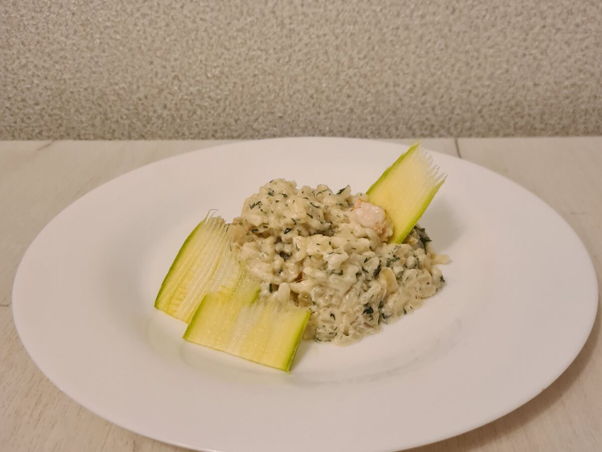 Creamy shrimp risotto topped with mozzarella and dill
