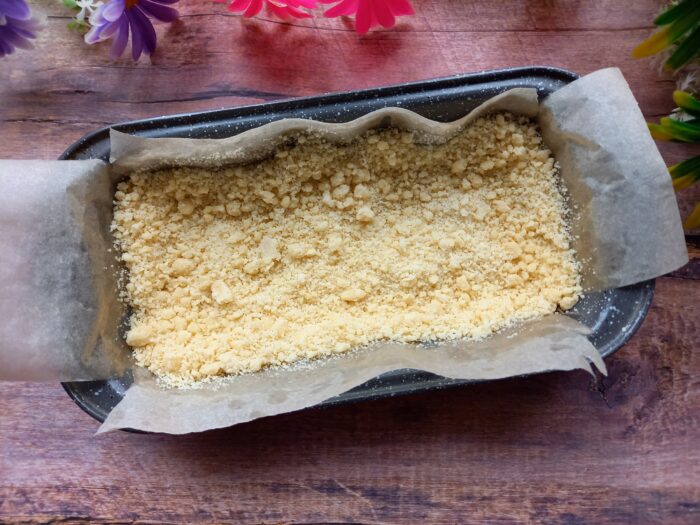 Spread about two-thirds of the crumbly dough