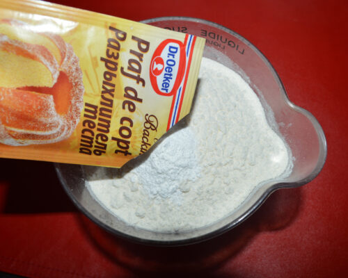 Mix baking powder with flour