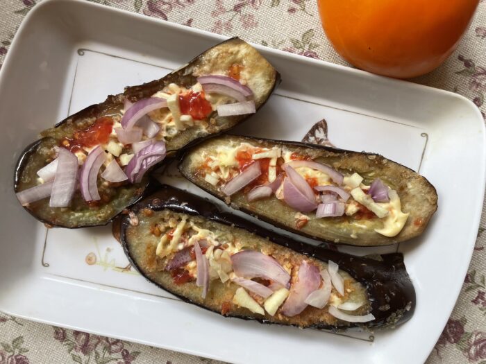 Savory Italian eggplant appetizer with garlic and onion garnish