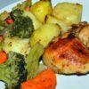 Dinner plated from oven-baked chicken and vegetable sleeve bag