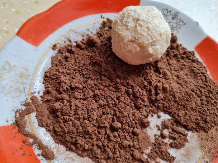 roll each cookie in the cocoa mixture