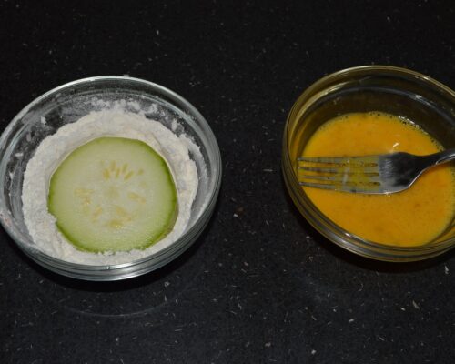 Dip each zucchini ring in the flour mixture