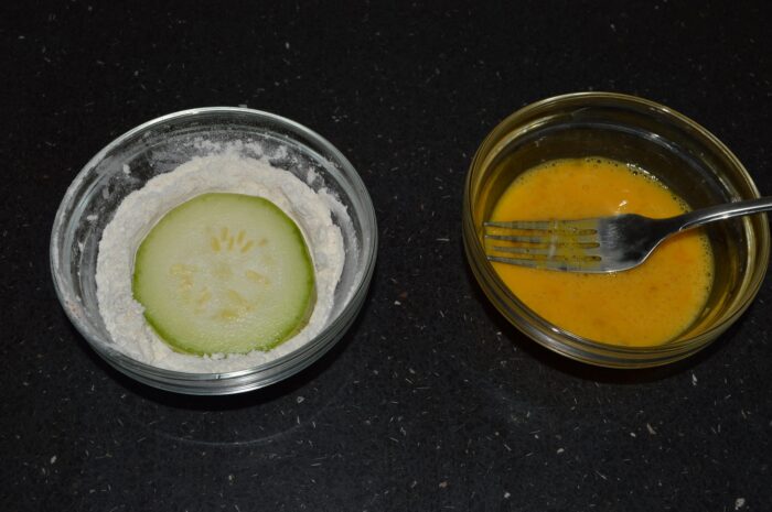 Dip each zucchini ring in the flour mixture