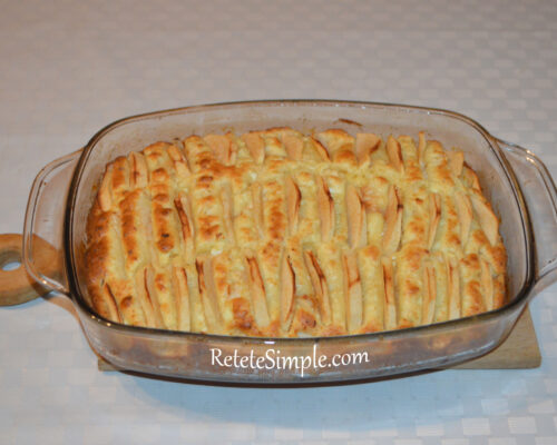 Golden baked apple and cheese cake in a baking dish