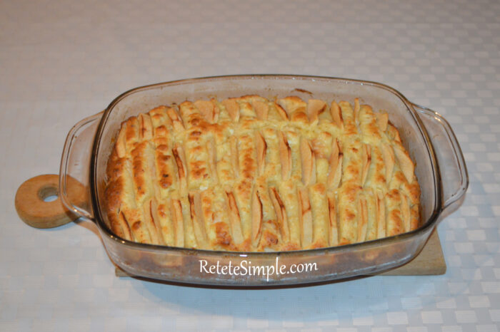 Golden baked apple and cheese cake in a baking dish