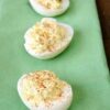 Close‑up of deviled eggs with creamy mustard‑mayo filling