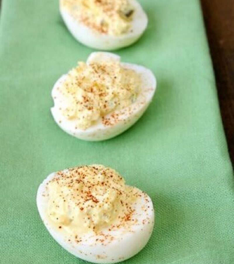 Close‑up of deviled eggs with creamy mustard‑mayo filling