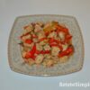 Juicy chicken pieces sautéed with peppers on plate