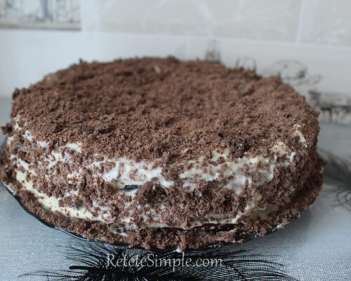 Sprinkle the crumbs over the top and sides of the cake