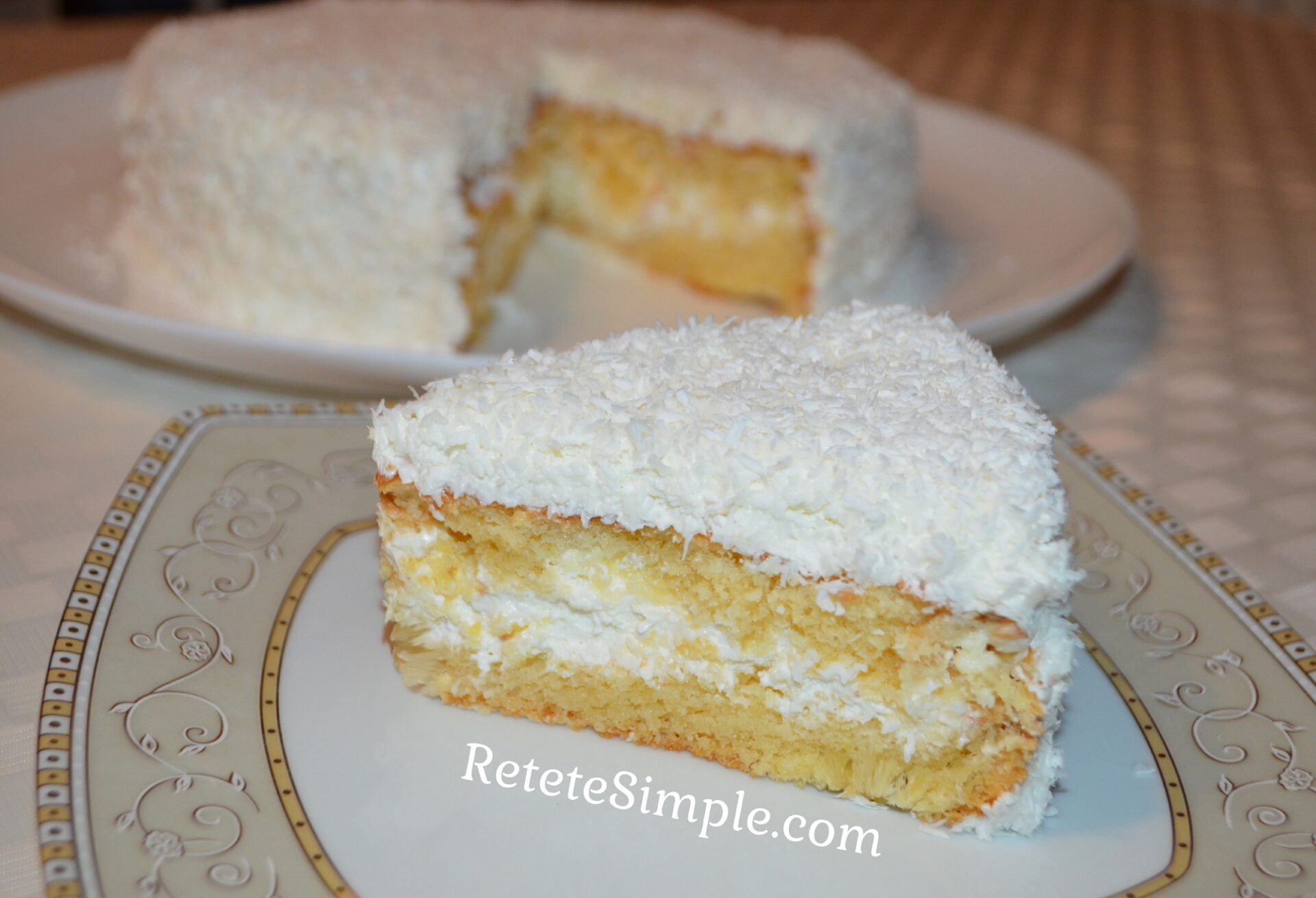 Slice of coconut cake showing creamy layers image