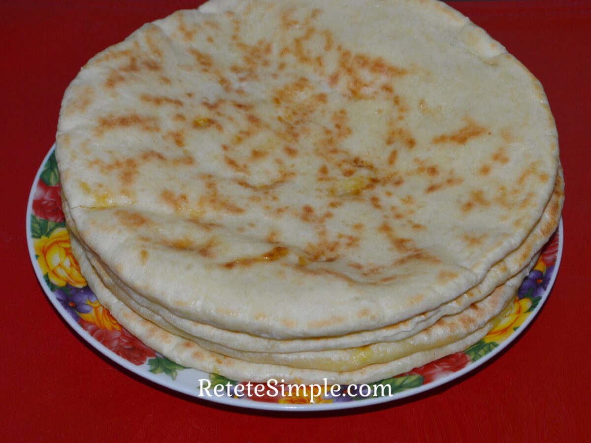 Golden pan-fried cheese turnovers on a plate