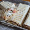 Healthy chicken shawarma wrap with yogurt sauce and fresh veggies