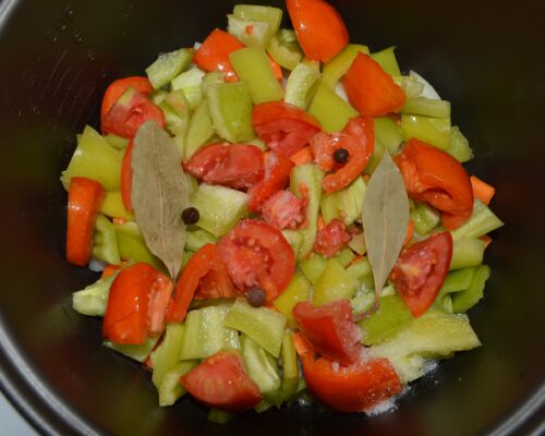 Add the black peppercorns and bay leaves