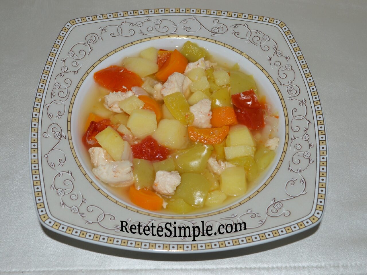 Served chicken stew with vegetables in bowl