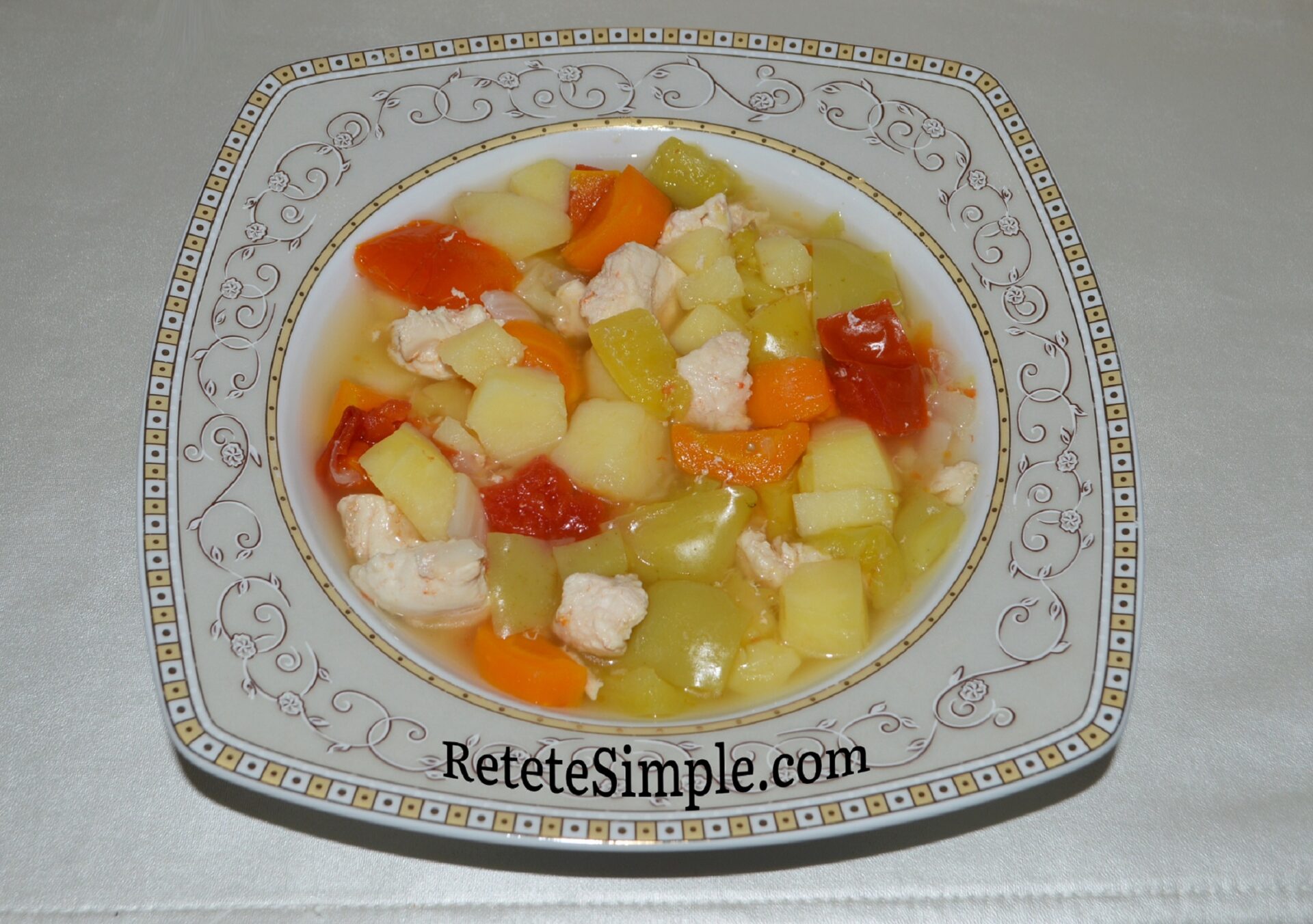 Served chicken stew with vegetables in bowl