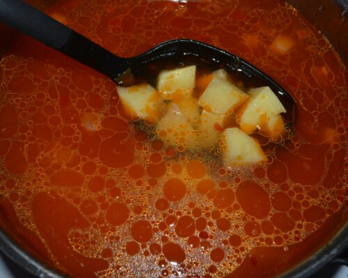 Pour in the water and add the potatoes to the saucepan