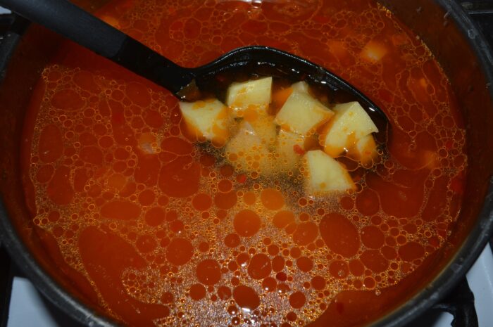 Pour in the water and add the potatoes to the saucepan