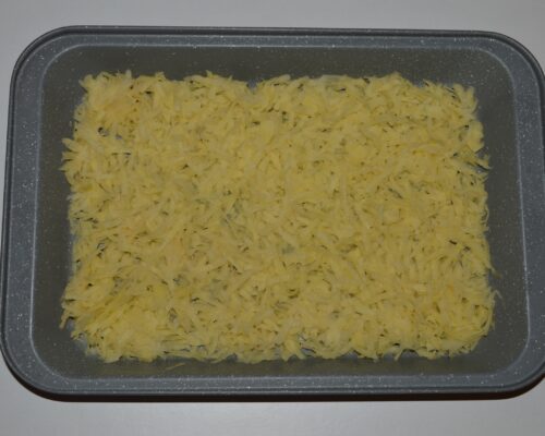 Peel the potatoes and grate