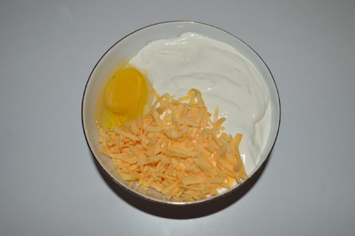 Grate the hard cheese