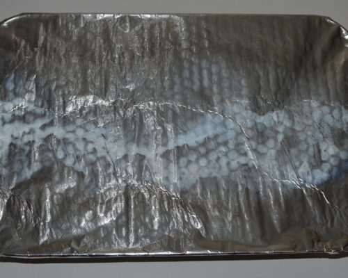 Cover the tray with aluminum foil