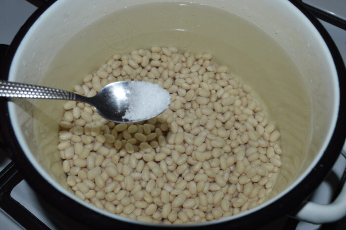 Pour the water into a saucepan and add the beans