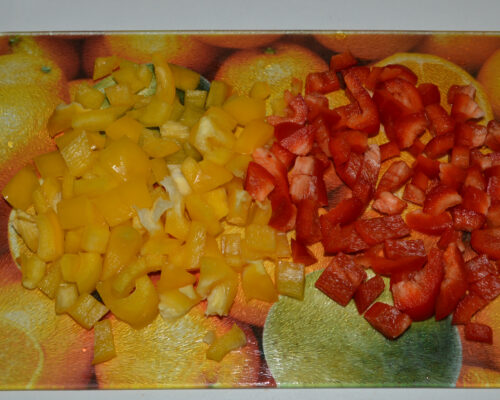 First, cut the yellow and red bell peppers