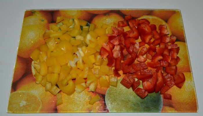 First, cut the yellow and red bell peppers