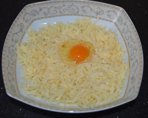 Grate the hard cheese