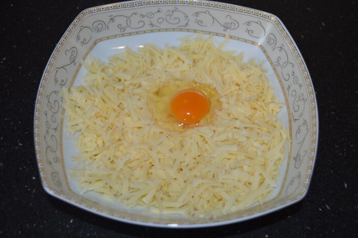 Grate the hard cheese